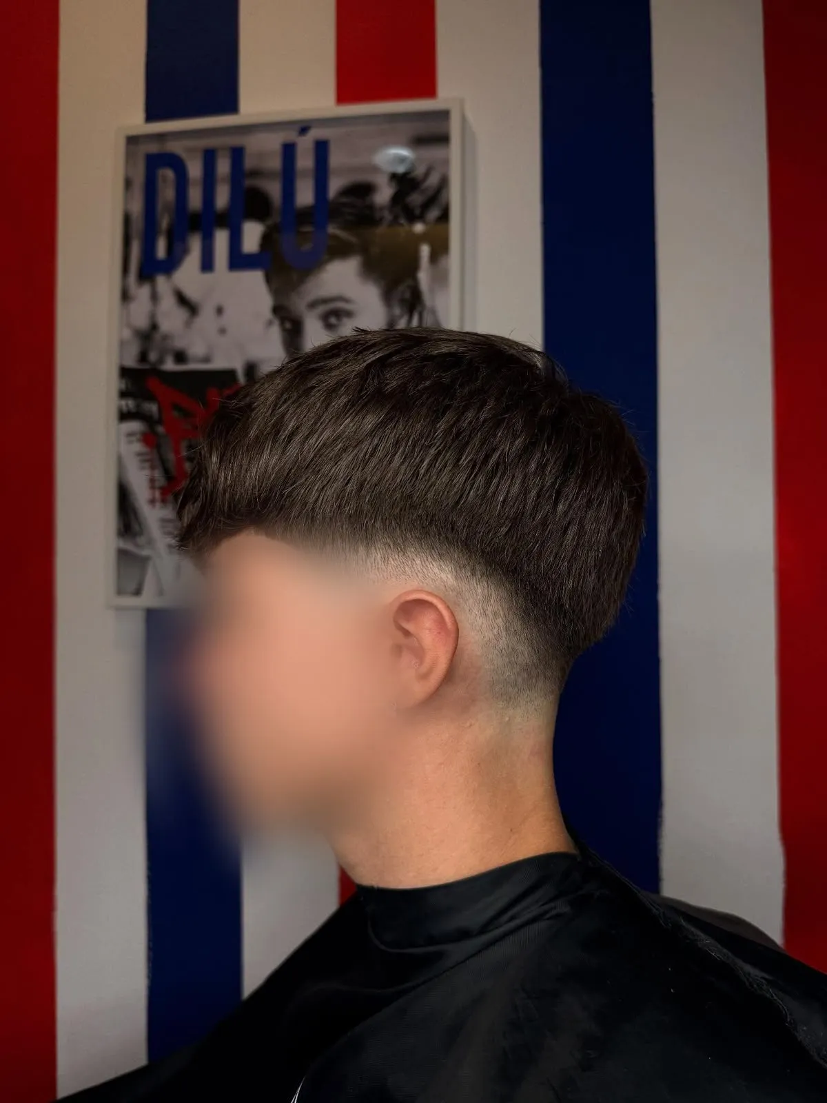 Taglio uomo con frangia e taper fade